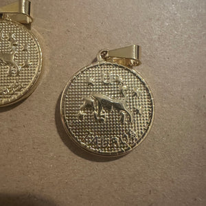 2 Taurus charms (gold)