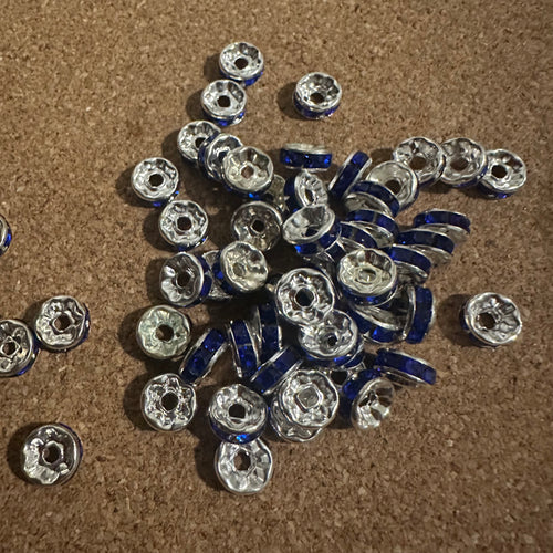 50 blue and silver rondelle spacers.