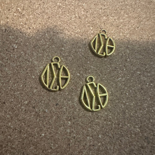 Gold Delta monogram charm.