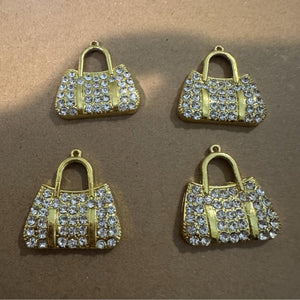 4 clear and gold purse charms