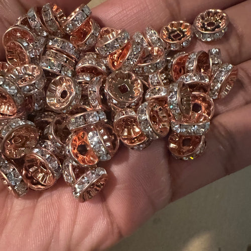 50 rose gold rondelle spacers.