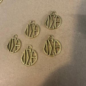 Gold Delta monogram charm.