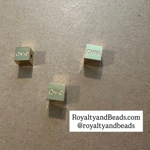 Omega Psi Phi block charms.