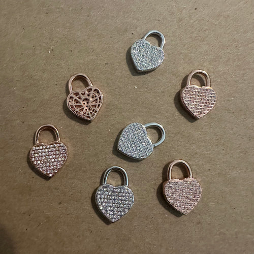 Pave heart lock charms.