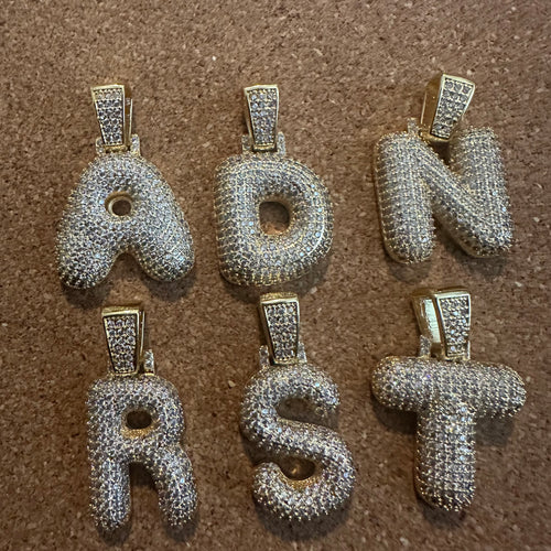 Large Gold pave letter charm.