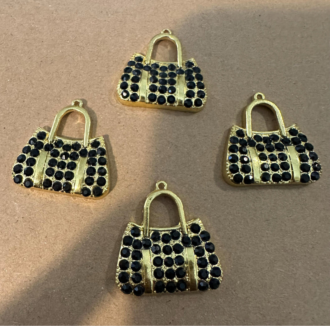 4 black and gold purse charms