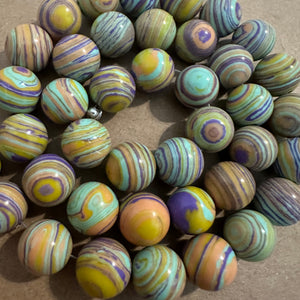 Yellow and purple swirl beads