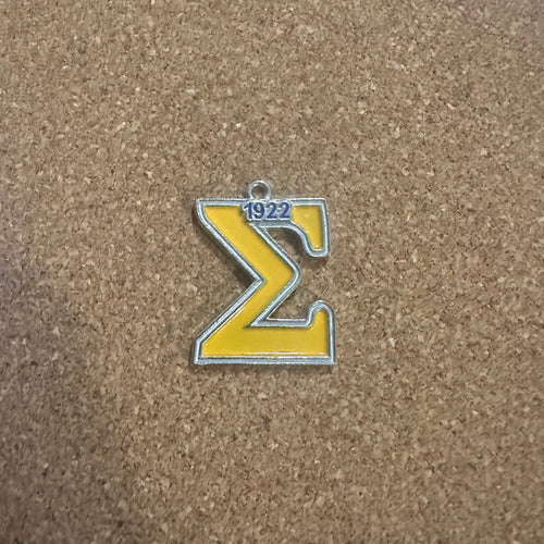 The yellow Sigma charm.