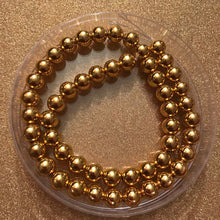 Load image into Gallery viewer, Gold hematite beads 8mm