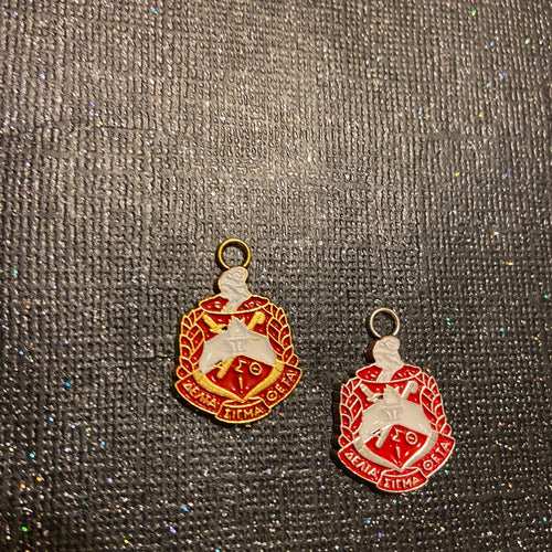 Delta crest charms