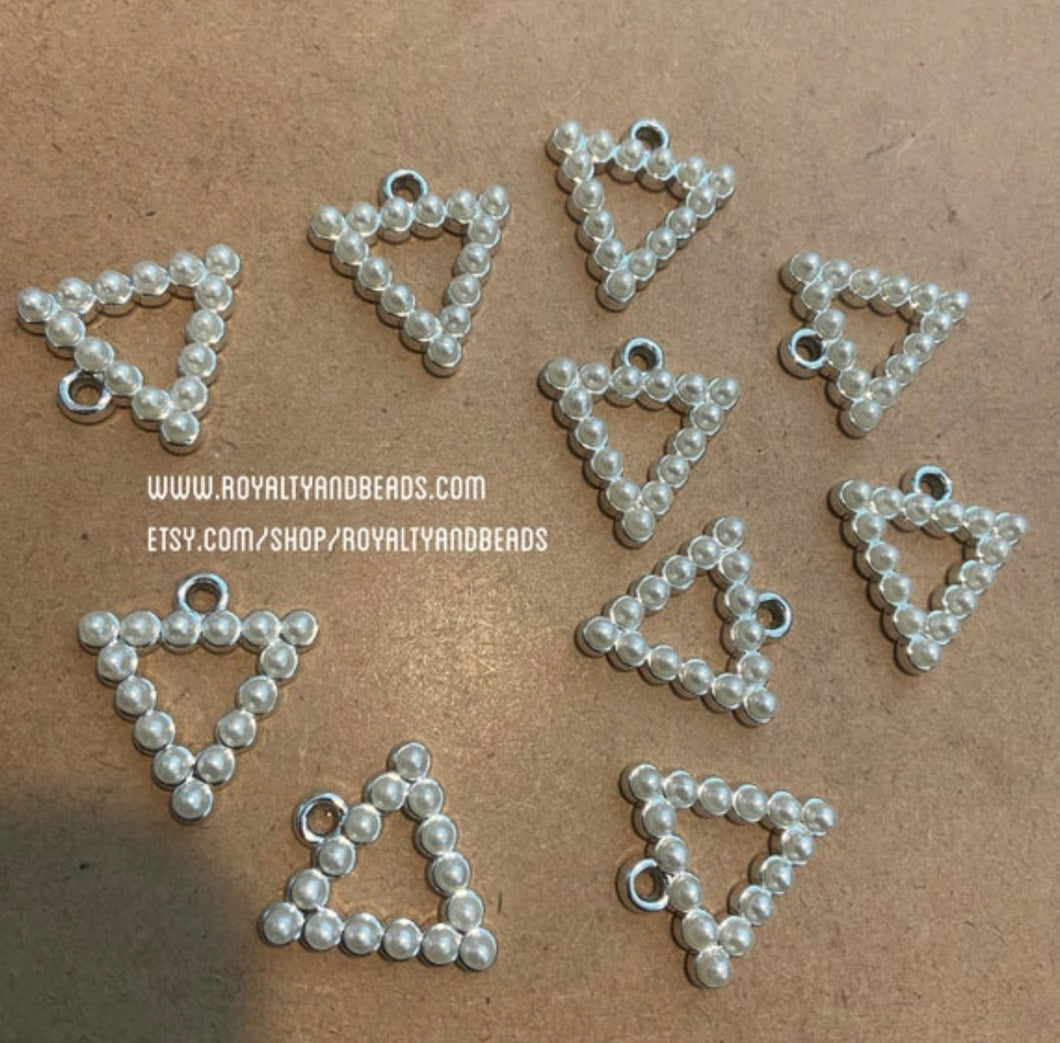 3 pyramid charms.